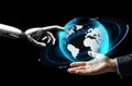 Human and robot hand with virtual earth hologram