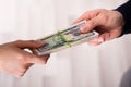 Human`s Hand Exchanging The Money Royalty Free Stock Photo