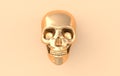 Human scull 3d rendering. Golden death`s-head on beige background