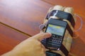 Human setting the timer on a cellphone connected to explosives Royalty Free Stock Photo