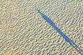 Human shadow on the sand Royalty Free Stock Photo