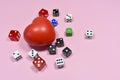 Spongy red heart and colored dice Royalty Free Stock Photo