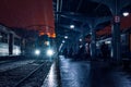 Human silhouettes in the dark on a train station on the platform