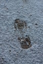 Human single footprint. white fresh winter snow. top view. Simple trace of boot Royalty Free Stock Photo