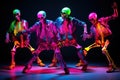 4 Human Skeleton Dancers Dance In Neon Colors At A Show Performance. Modern Break Dancing Performed By Fashionable And