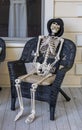 Human skeleton sitting in a chair