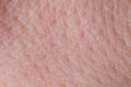 Human skin texture close up. Macro of brown young person clean skin Royalty Free Stock Photo