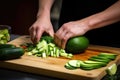 human slicing avocado for fresh summer sandwich