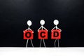 Human stick figure holding red OCD or Obsessive Compulsive Disorder acronym banner. Black background.