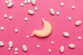 Human stomach with pills on pink background. Treatment of pain and inflammation. Symptom of gastritis and heartburn