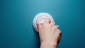 Human Switches On A Toggle Switch On The Blue Wall Royalty Free Stock Photo