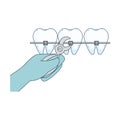 Human teeth with hand orthodontist and pliers