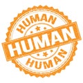 HUMAN text on orange round stamp sign
