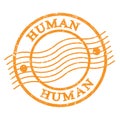 HUMAN, text written on orange postal stamp