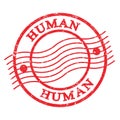 HUMAN, text written on red postal stamp