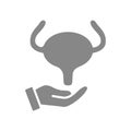 Human urinary bladder on hand gray icon. Disease prevention symbol