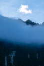 Misty mountains and human villages Royalty Free Stock Photo