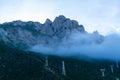 Misty mountains and human villages Royalty Free Stock Photo