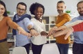 Group of diverse multiethnic people joining hands together front view shot