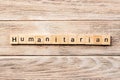 Humanitarian word written on wood block. humanitarian text on table, concept Royalty Free Stock Photo