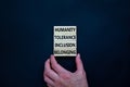 Humanity, tolerance, inclusion, belonging symbol. Wooden blocks with words humanity, tolerance, inclusion, belonging on beautiful Royalty Free Stock Photo