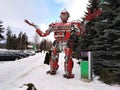 The humanoid metal funny robot the autoboat Red, is made of car spare parts, refuels gasoline, parts of body of the robot,