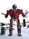 The humanoid metal funny robot the autoboat Red, is made of car spare parts, refuels gasoline, parts of body of the robot,