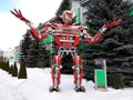 The humanoid metal funny robot the autoboat Red, is made of car spare parts, refuels gasoline, parts of body of the robot,