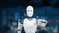 Humanoid robot interacting with digital interface in futuristic workspace, showcasing advanced technology and artificial Royalty Free Stock Photo