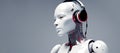 A humanoid robot listens to music in headphones on a grey background. Banner, place for text.