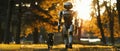 A humanoid robot takes a leisurely walk with a black dog through a park bathed in the golden light of an autumn sunset. Royalty Free Stock Photo