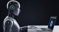 Humanoid robot working on a laptop in a dark modern office environment, representing artificial intelligence, automation. Royalty Free Stock Photo