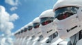 Humanoid robots with sleek white exteriors and reflective helmets stand in a perfect row, showcasing modern robotics and