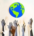 Humans hands raised up celebrating togetherness, teamwork and support. Paper made background