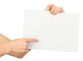 Humans right finger pointing at blank paper