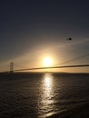 Bridge and helicopter at sunset Royalty Free Stock Photo