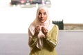 Humble Muslim Woman Holding Hands Up and Praying in Peace