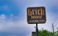 Brick House Tavern + Tap sports bar street sign in Humble TX. Royalty Free Stock Photo
