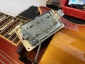Humbucking pick up of electric guitar that is removed inside the guitar body, in case it is repaired, can be used as a preview in Royalty Free Stock Photo