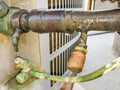 Humid leaking pipe of a central air conditioning system and cold water drops on it Royalty Free Stock Photo