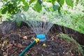 Humidification compost pile using sprinkler Royalty Free Stock Photo