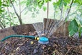 Humidification compost pile using sprinkler Royalty Free Stock Photo
