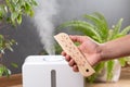 Humidifier and thermometer measuring the optimum temperature and humidity in a house apartment or office a photo for articles