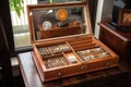 humidor with selection of fine cigars and accessories