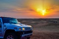 Hummer H2 jeep resting after a tired day at the traditional activity of Dubai Desert Safari Royalty Free Stock Photo
