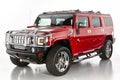 Hummer H2. Red Hummer isolated on white. Big American car loaded with chrome