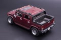 Hummer toy car on black background.