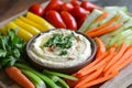Hummus with Carrots, Celery, Cucumbers, Bell Peppers, and Tomatoes Royalty Free Stock Photo