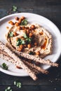 Hummus with crunchy Chickpeas and Bread stick for Starter. Royalty Free Stock Photo