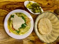 Hummus dish with tahini. Pita bread. Pickles. Classic. Royalty Free Stock Photo